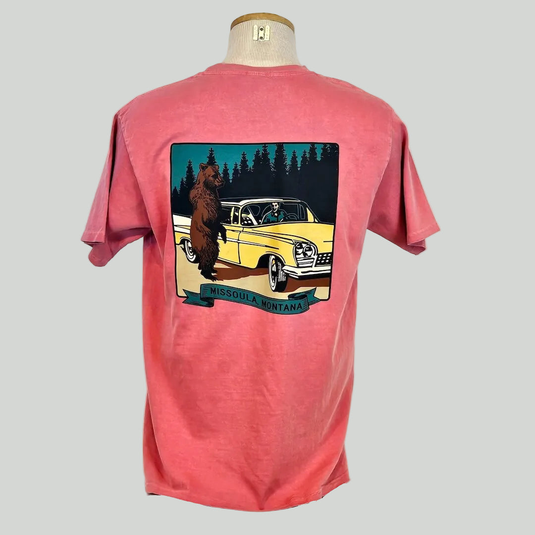 Red t-shirt with a graphic of a bear and vintage car on a mannequin against a white background