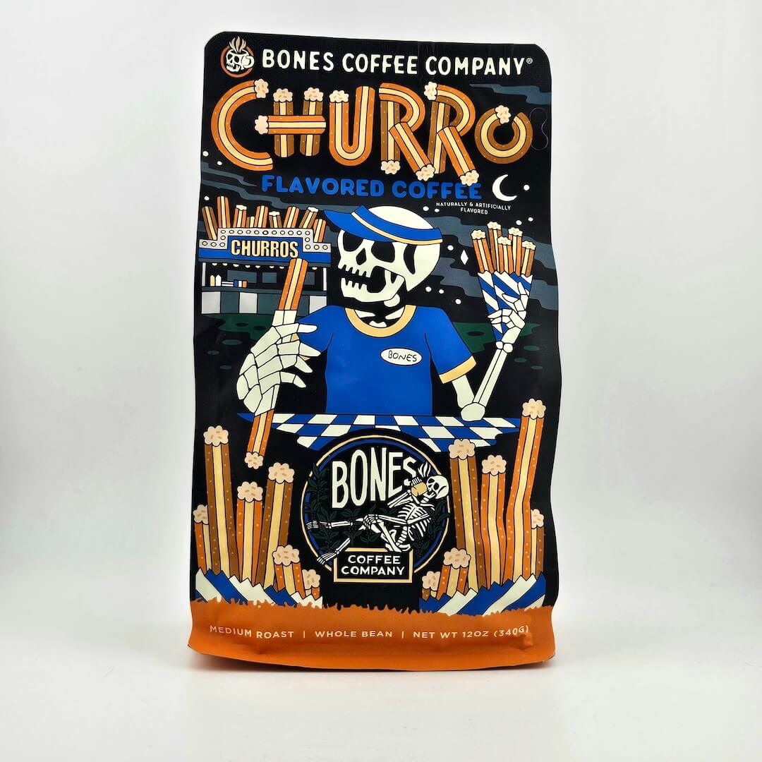 Black coffee bag with "Bones Coffee Company" branding and skeleton illustration. 