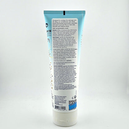 Back view of a haircare product tube with text on a white background