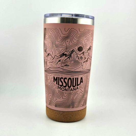 Tumbler with topographic design and 'Missoula Montana' text on a white background