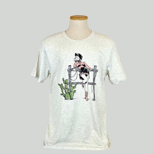 White t-shirt with a graphic design of a woman and cactus on a mannequin against a white background