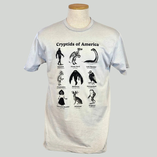 T-shirt with illustrations of cryptids of America on a mannequin against a white background