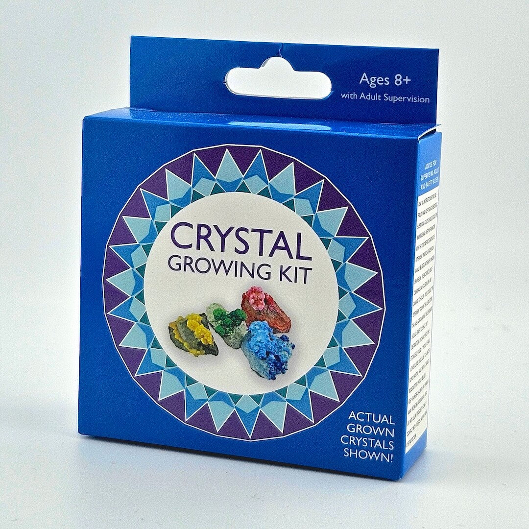 Crystal growing kit packaging with colorful crystals on a blue background