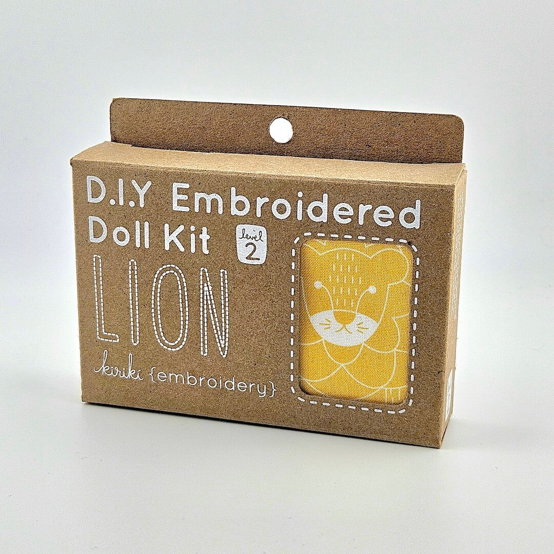 D.I.Y Embroidered Doll Kit for a lion on a cardboard box with a white background