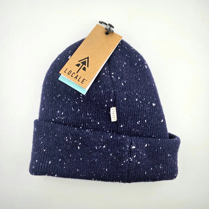 Navy blue speckled beanie with a 'Locale' tag on a white background