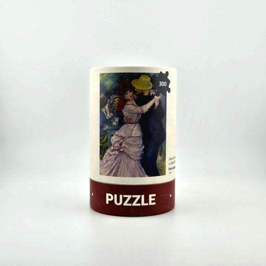 Jigsaw puzzle box with artwork of a couple dancing on a white background
