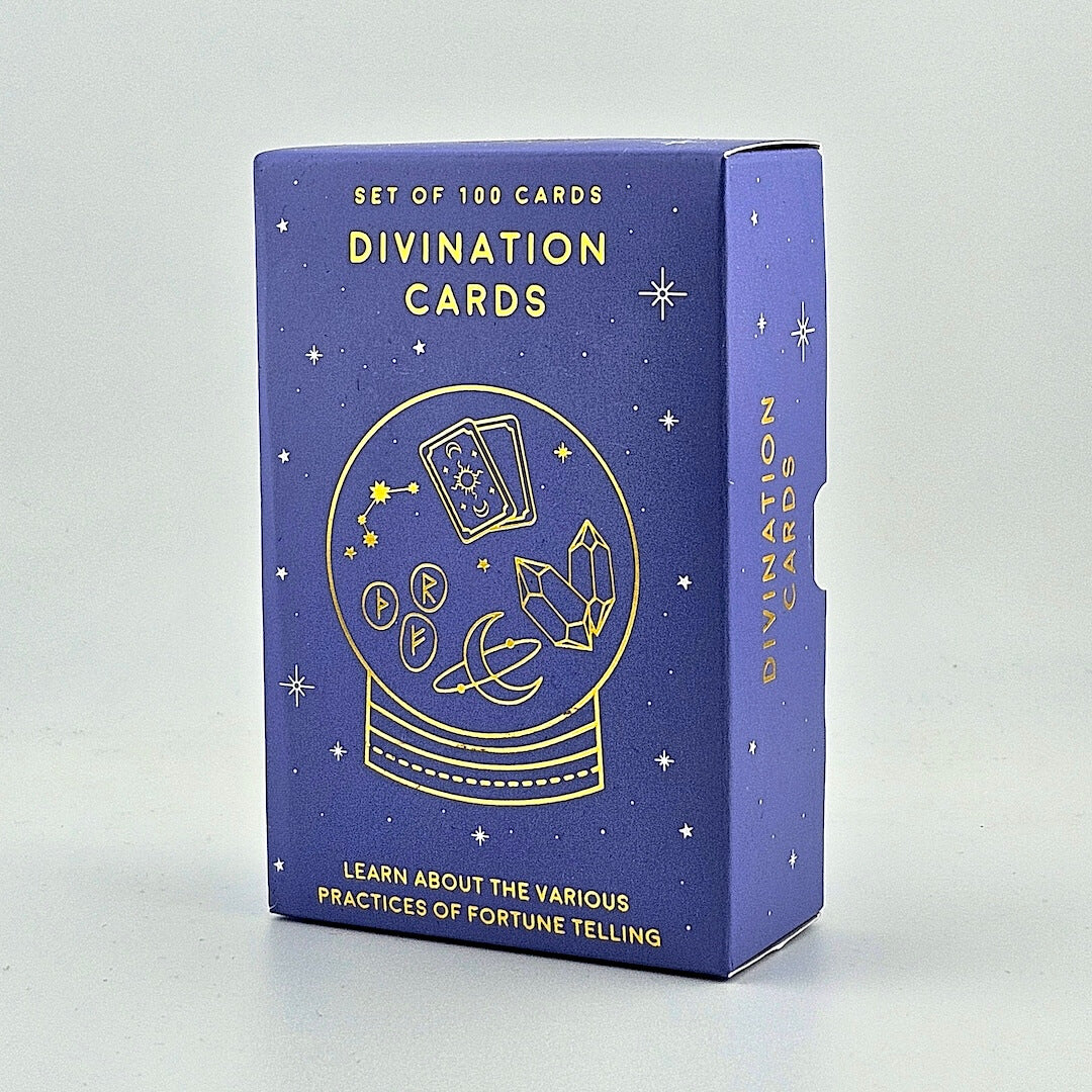 Blue box of divination cards with gold text and symbols on a light gray background