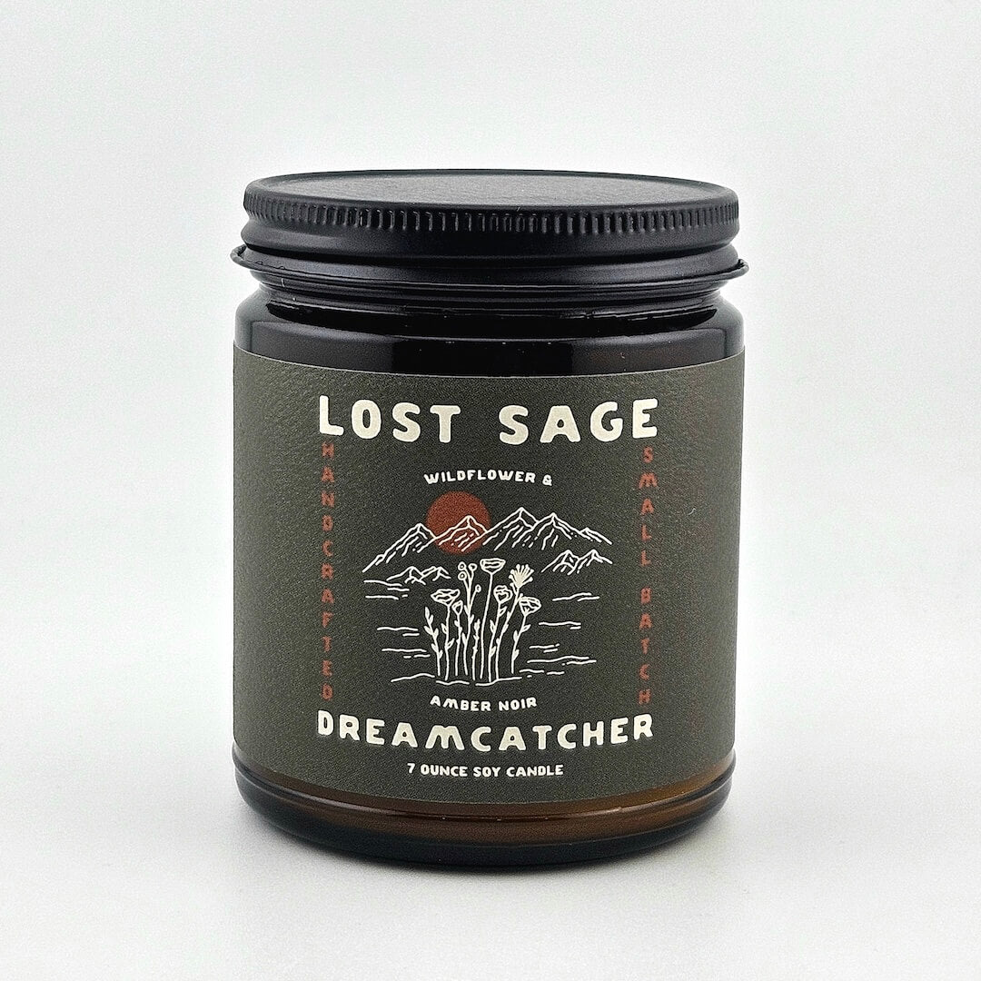 Candle jar with 'Lost Sage' label on a white background