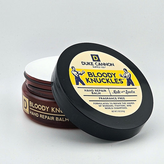 Tub container for hand repair balm against white background.