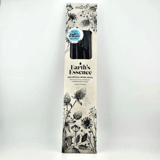 Earth's Essence candle packaging with floral design on a white background