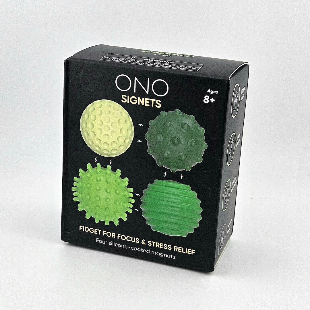 Box of ONO Signets fidget toys with green and yellow designs on a gray background