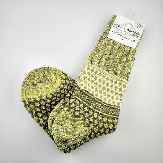 Pair of brightly colored socks with visible brand label against light gray background.
