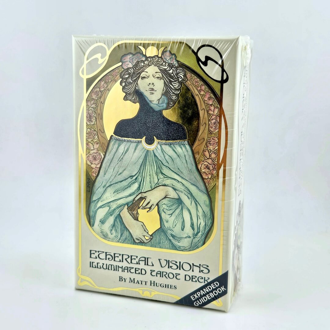 Ethereal Visions Illuminated Tarot Deck packaging with a woman's face and floral design on a white background