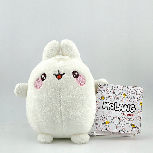 White stuffed bunny-like animal with tag against white background. 