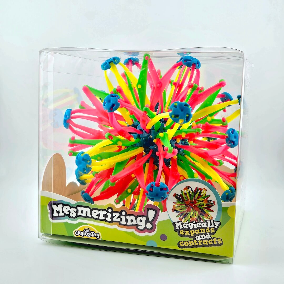 Colorful expandable toy in packaging with 'Mesmerizing!' text on a white background