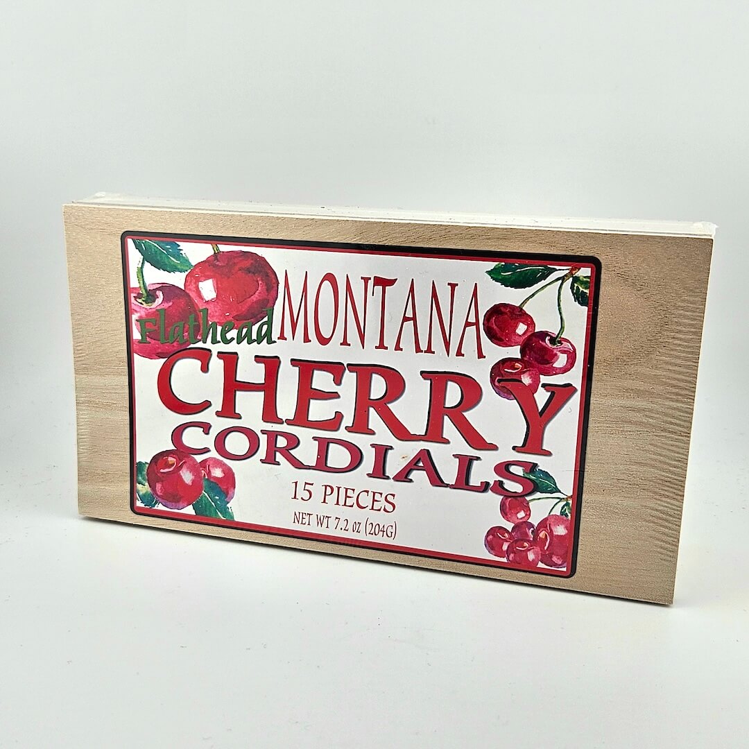 Box of Montana Cherry Cordials with cherry illustrations on a white background