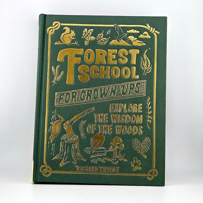 Book titled 'Forest School for Grown Ups' with gold text and illustrations on a green background