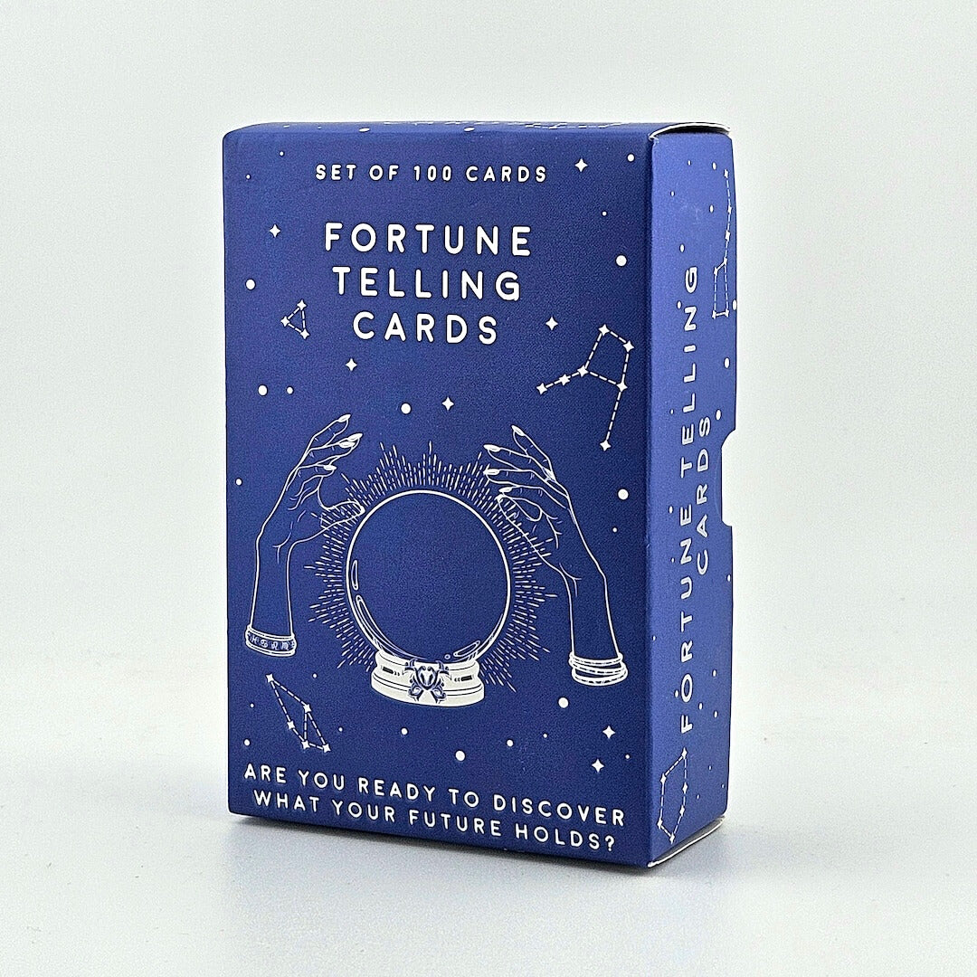 Blue box of fortune telling cards with white text and illustrations on a light gray background