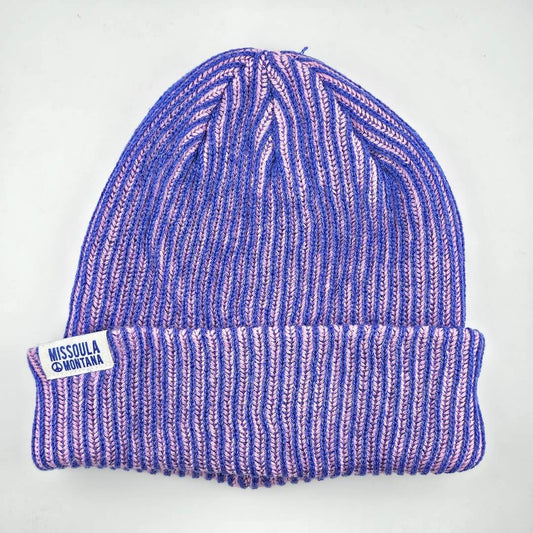 Purple and pink striped beanie with 'Missoula Montana' label on a white background
