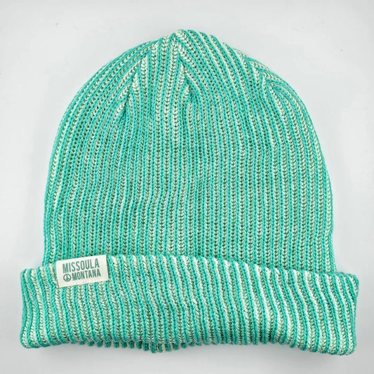 Teal knit beanie with 'Missoula Montana' label on a light gray background