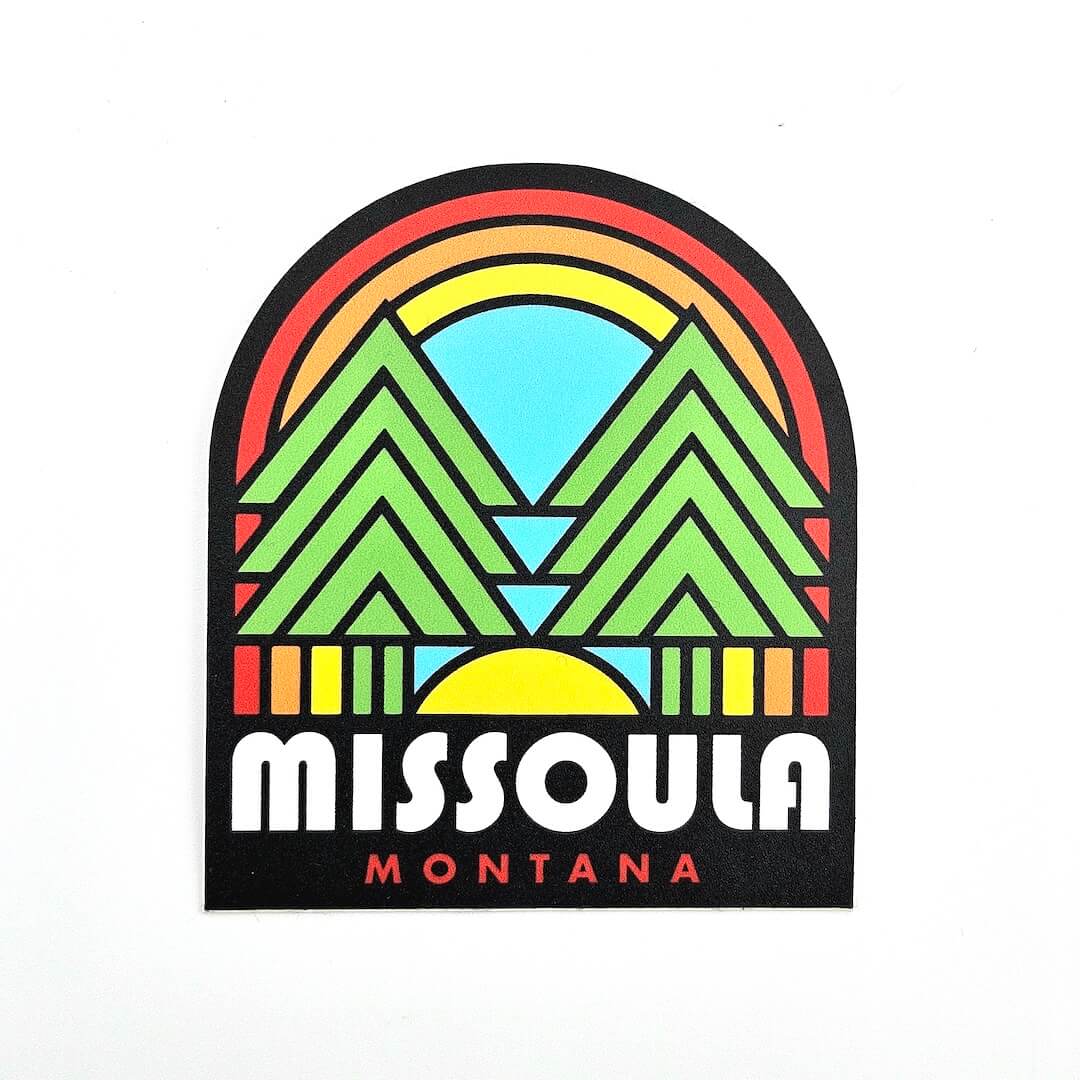 Sticker with a colorful mountain and rainbow design with 'Missoula Montana' text on a white background.