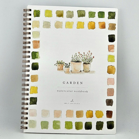 Notebook titled 'Garden' with watercolor plant illustrations on a gray background