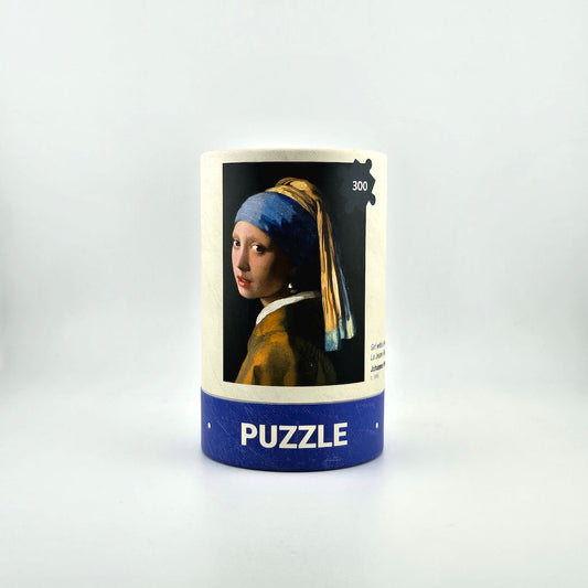 Puzzle box featuring 'Girl with a Pearl Earring' by Vermeer on a white background