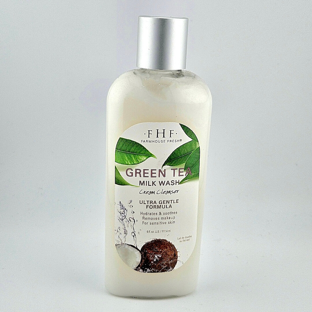 Bottle of Green Tea Milk Wash with a silver cap on a light gray background