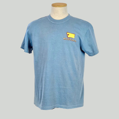 Blue t-shirt with a yellow and red logo on a mannequin against a white background