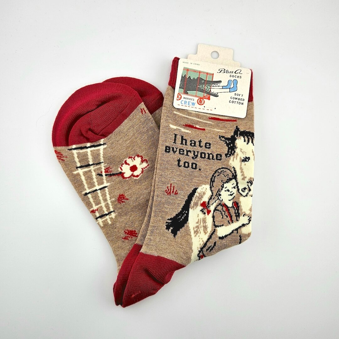 Pair of socks with a design and text on a white background
