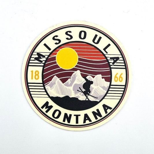 Round sticker with 'Missoula Montana' text and mountain design on a white background