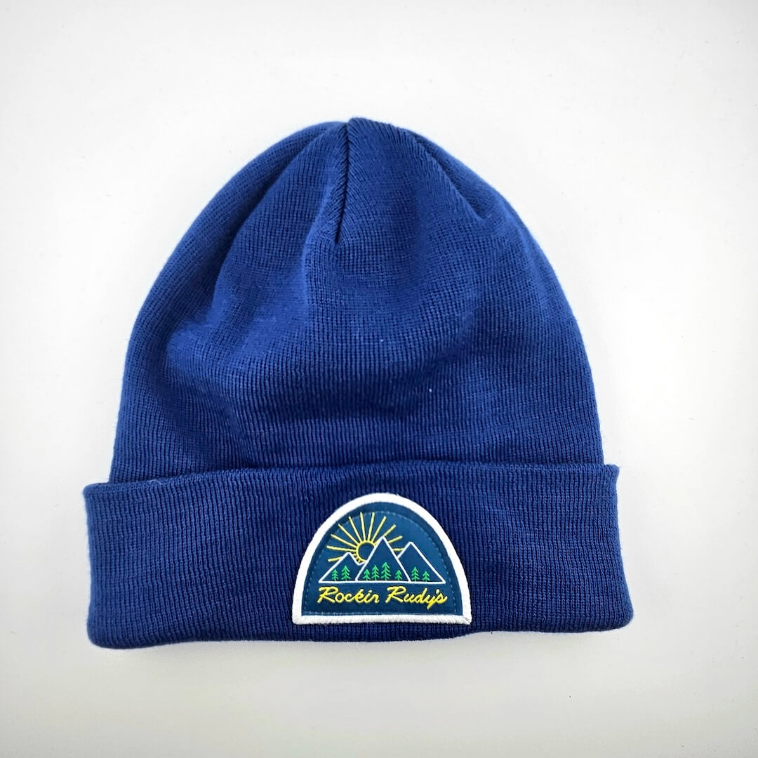 Blue beanie with a logo patch on cuff for Rockin Rudy's on a white background