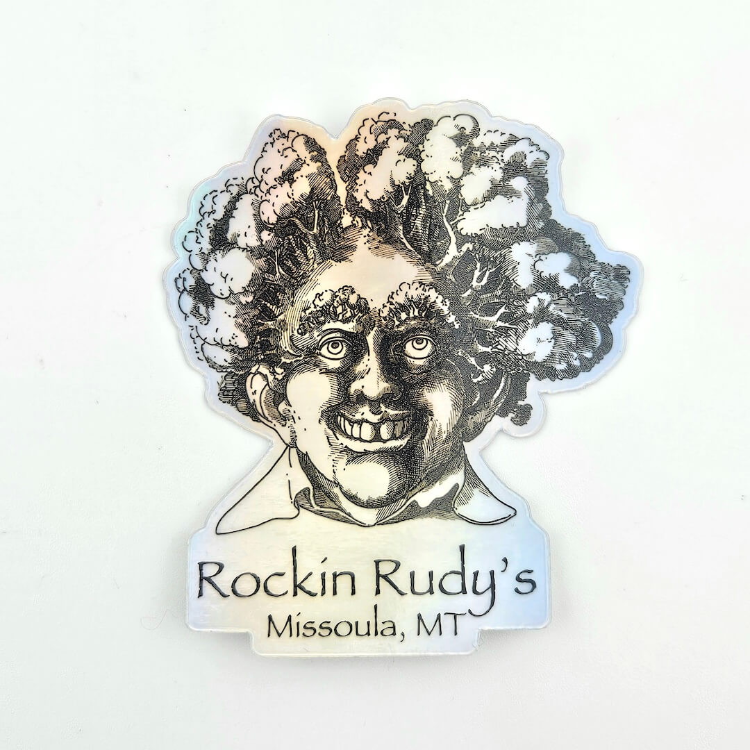 Sticker with a stylized face and 'Rockin Rudy's Missoula, MT' text on a white background