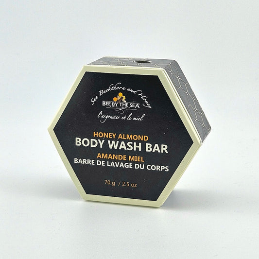 Hexagonal container of Honey Almond body wash bar by Bee by the Sea on a white background