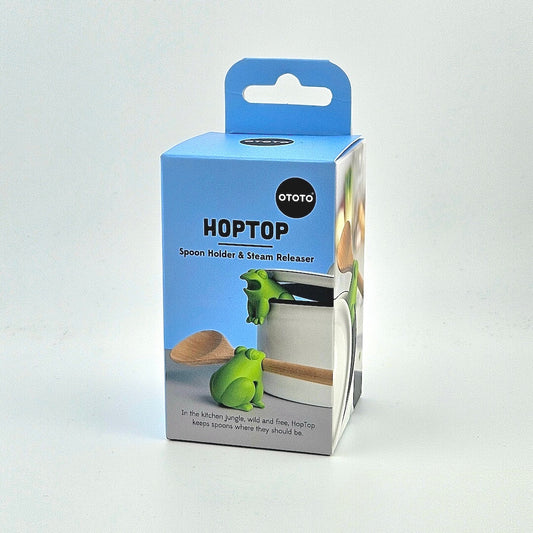 Blue box for frog shaped spoon holder and steam release against white background.