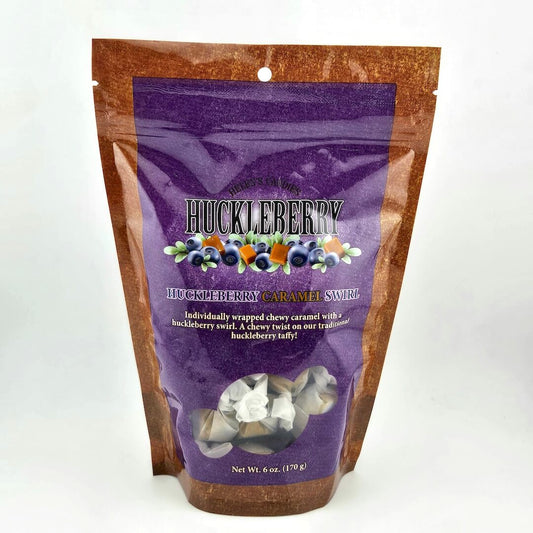 Purple bag of Huckleberry Caramel Sweets with brown sides on a white background