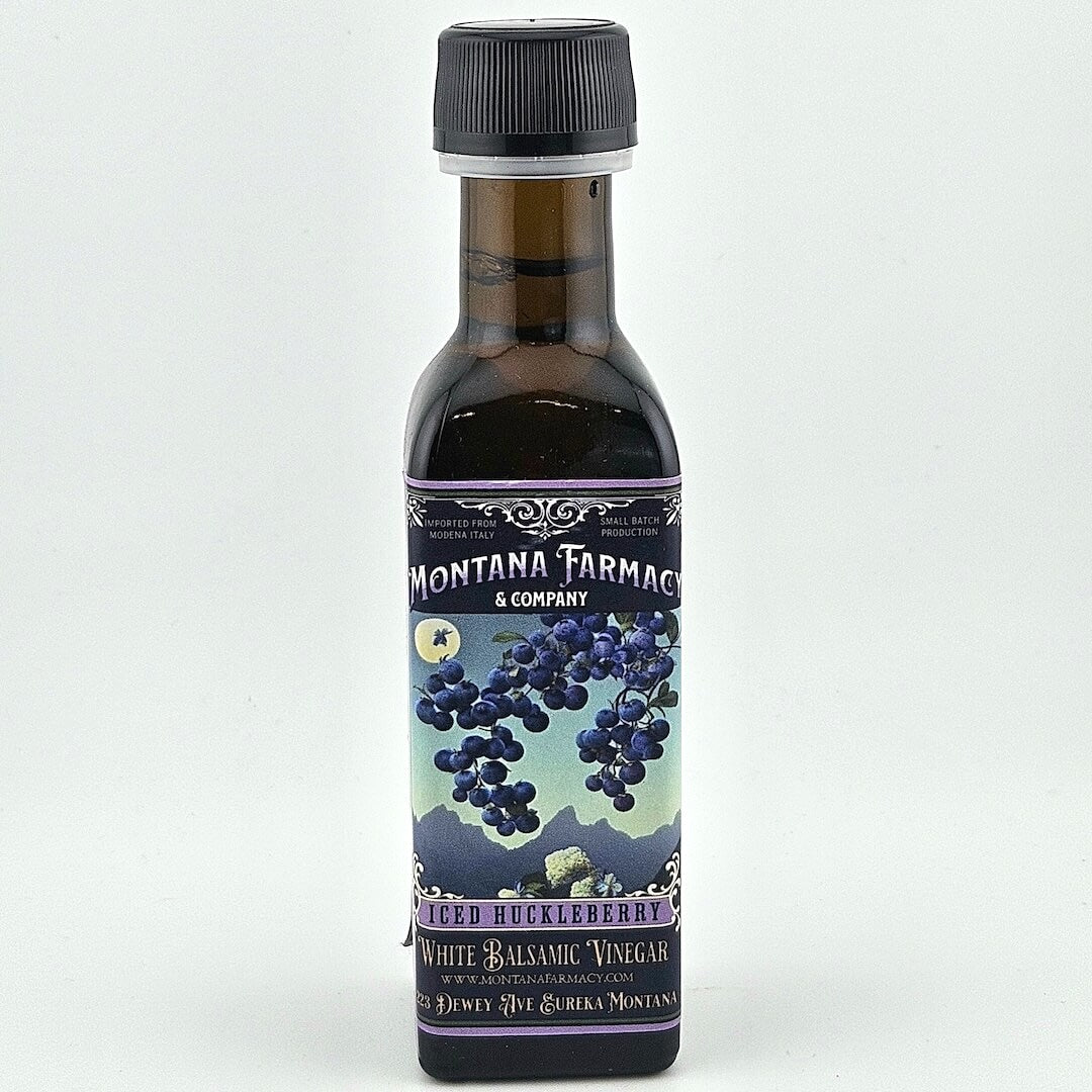 Bottle of Montana Farmacy & Company Huckleberry White Balsamic Vinegar on a white background