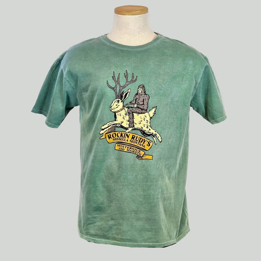 Green t-shirt with a graphic design on a mannequin against a white background