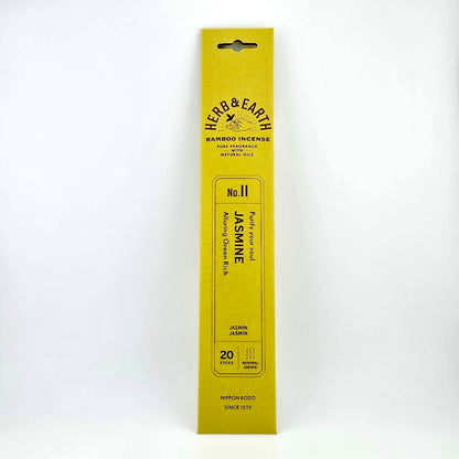 Yellow-green rectangular package of incense with brown text describing product. 