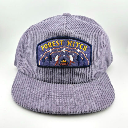 Purple corduroy cap with 'Forest Witch' patch on a white background