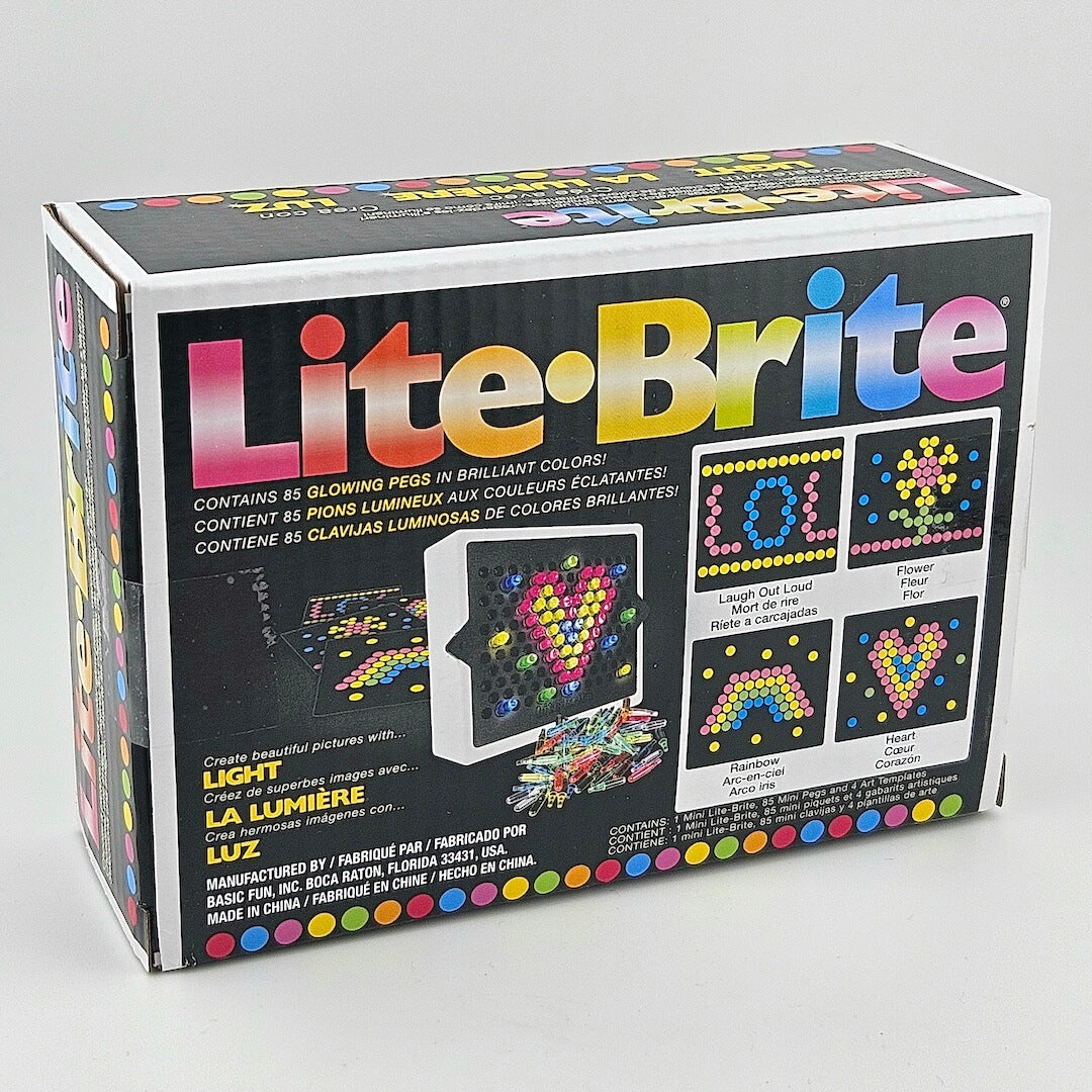 Box of Lite-Brite toy on a gray background