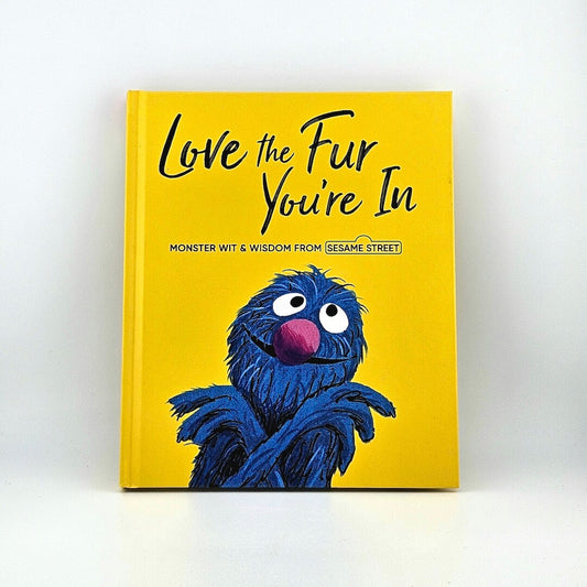 Cover of yellow book with blue monster on cover under title, "Love the Fur You're In."