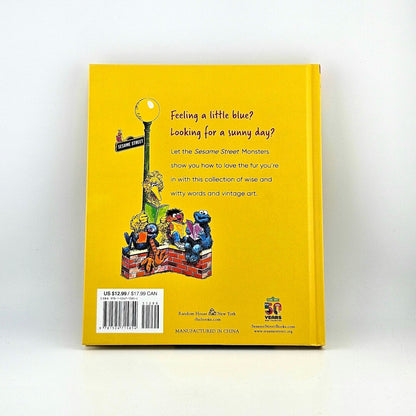 Backside of yellow book with summary and barcode against white background. 