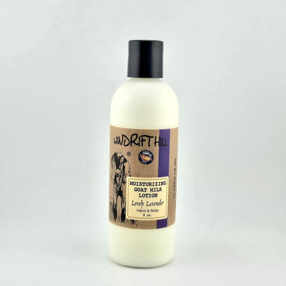 Plastic bottle of Windrift Hill moisturizing goat milk lotion on a gray background