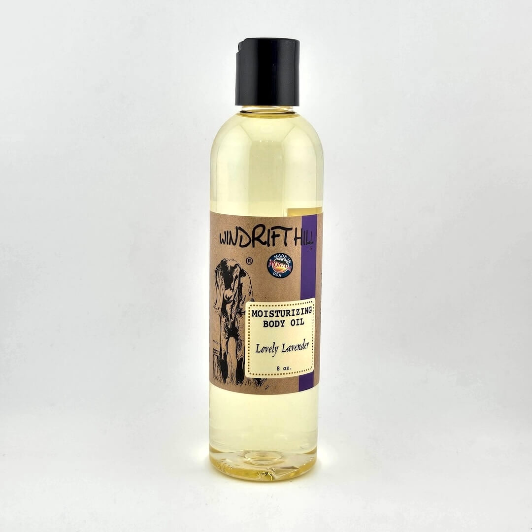 Plastic bottle of Windrift Hill moisturizing body oil on a gray background