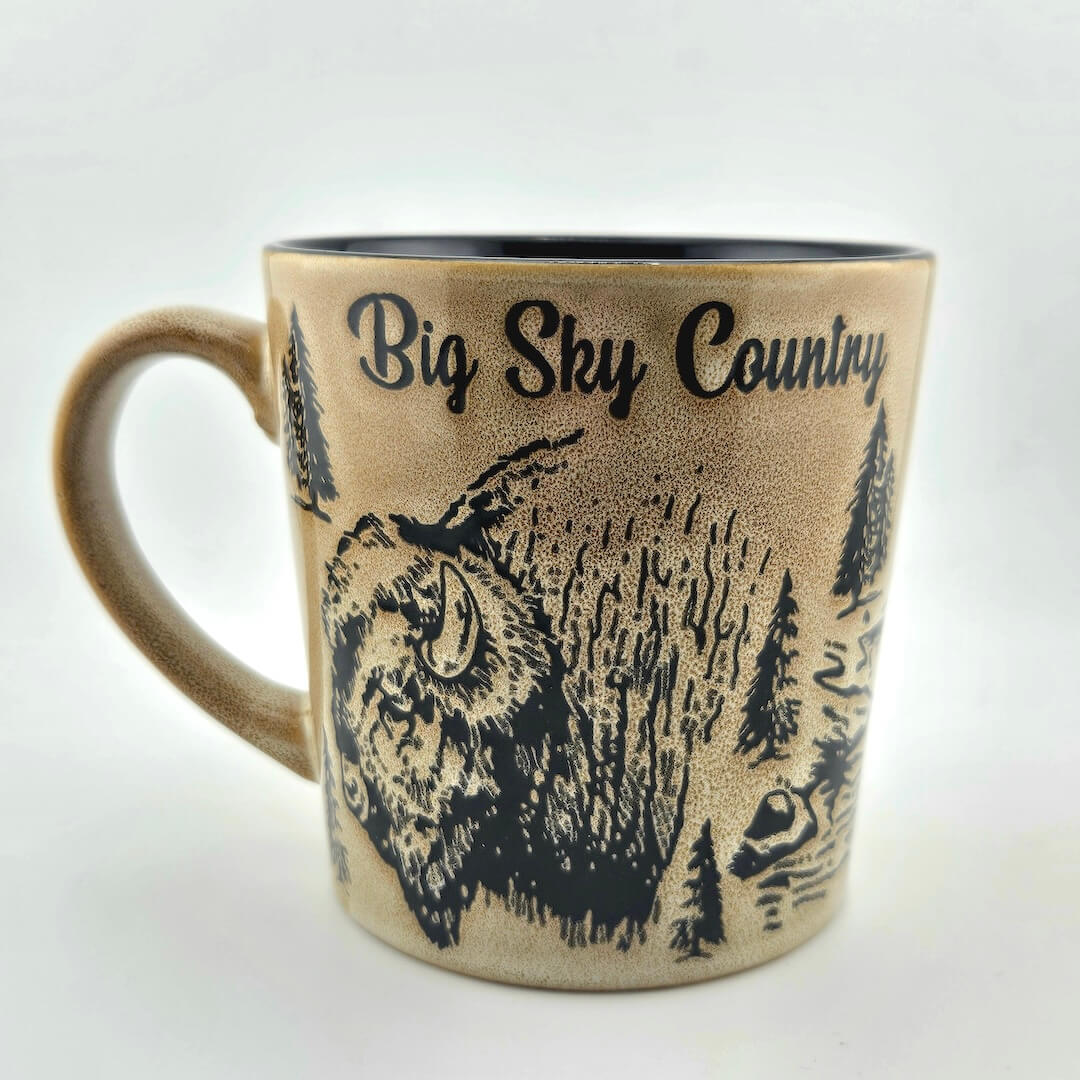 Mug with 'Big Sky Country' text and bison design on a beige background