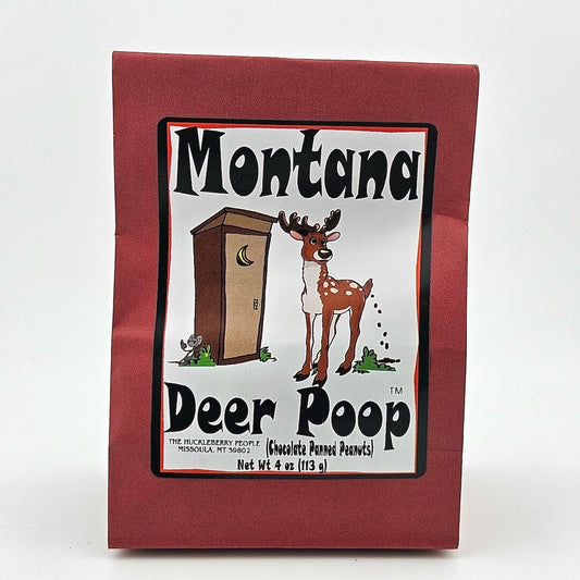 Red paper bag; white label has image of deer outside outhouse framed by product information. 