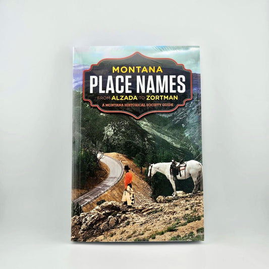 Book titled 'Montana Place Names' with mountain road landscape on cover on a white background