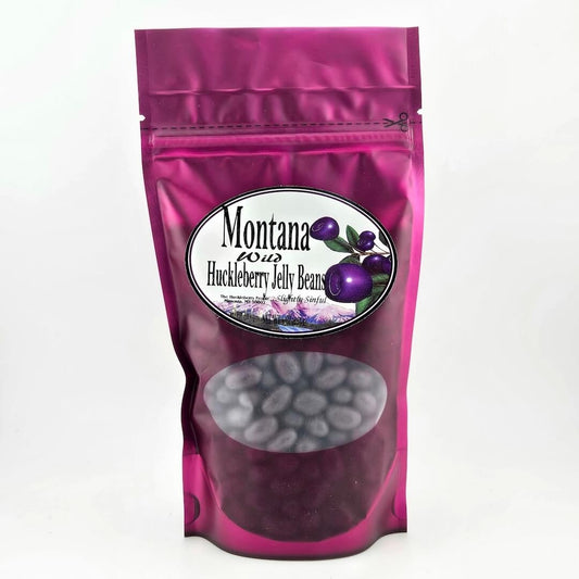 Pink packaging of Montana Huckleberry Jelly Beans with a visible brand label on a white background
