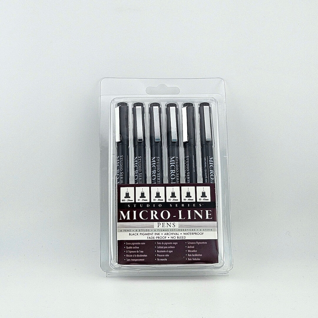 Clear package of six pens with black ink against white background.